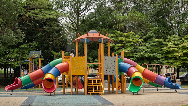 A colorful outdoor playground with slides and climbing structures