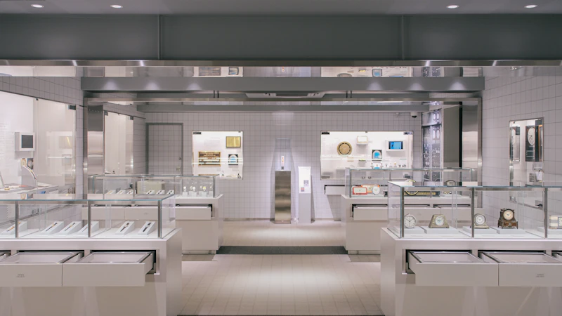 A bright, modern jewelry store with glass display cases