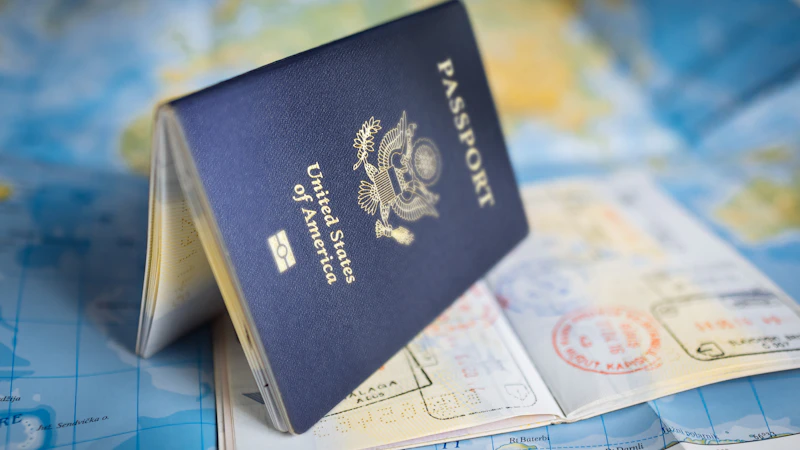 A passport resting open on a colorful world map